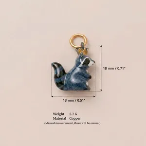 Detailed macro view of cute enamel raccoon pendant with size and material specifications