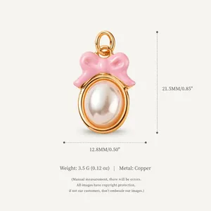 Ciondolo fiocco rosa dorato con perla, accessorio gioielleria in rame altezza 21,5 mm