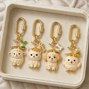 Close-up of cute animal bag charms with straw hats and gold-plated carabiners