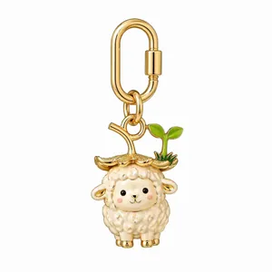 Detail view of a cute gold-plated sheep keychain with a green sprout hat ornament.