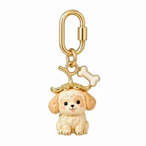 Macro detail of a cute dog animal keychain with a gold-plated clasp and bone charm