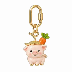Detailed view of a cute pink pig charm with carrot straw hat and gold clasp.