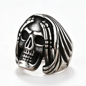Close-up of vintage titanium steel skull ring with distressed finish punk style