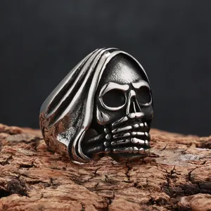 Detailed macro shot of vintage grim reaper skull ring in antique titanium steel finish