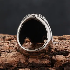 Macro view showing the detailed inside band of this vintage gothic skull steel ring.