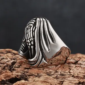 Detailed macro view of vintage gothic grim reaper skull ring in dark stainless steel