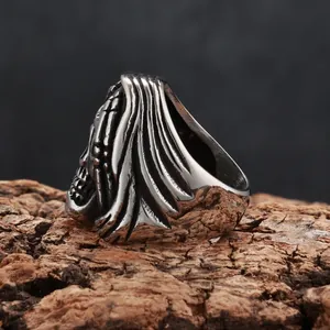 Detailed macro shot of vintage Grim Reaper skull ring featuring textured steel hood