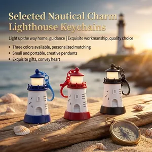 Glow-in-the-dark lighthouse keychains in blue, red, and black on a beach setting.