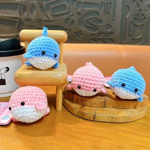 Cute handmade crochet whale keychains in blue and pink, perfect plush bag charms and gifts