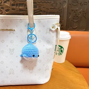 Cute handmade blue crochet whale keychain for bag decoration and gift idea.