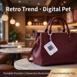 Retro electronic pet keychain game hanging from a leather handbag in a cafe