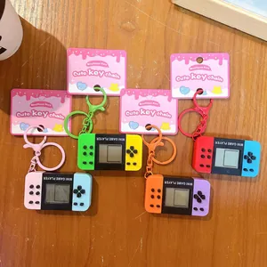 Mini handheld game console keychains in colorful Switch style designs set