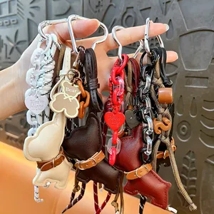 Vintage leather puppy dog keychain charms in various colors for stylish bag accessories
