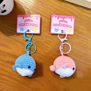 Handmade crocheted small whale keychain set featuring adorable blue and pink sea animal pendants