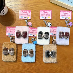 Creative plush bow keychain with portable makeup mirror and colorful bell charm