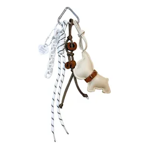 Vintage leather dog keychain charm for bags and luggage with heart tag and cord details