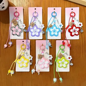 Set of colorful alloy flower keychains with braided ropes and cute charms for bag decor
