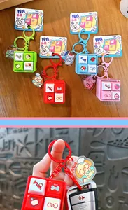Mini llavero fidget toy de tecla de teclado mecánico con ilustraciones de dibujos animados.