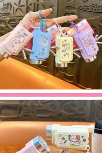Close-up of colorful cartoon animal projector camera keychains with cute graphics