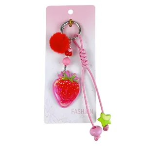 Porte-clés fraise créatif avec pompon rouge et joli pendentif en cordon tressé rose