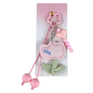 Adorable pink tulip plush bag charm keychain with heart bead accents for girls and women