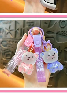 Macro detail showing the translucent resin texture of the cute bear keychain charms.
