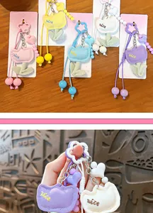 Detailed view of cute colorful tulip flower plush bag charms and keychains in various colors.