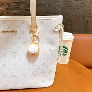 Creative glowing Xiaolongbao keychain pendant for bags, cute stress relief toy gift