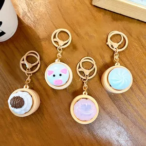 Creative glowing steamed bun keychain fidget toy with cute food designs for bag pendants