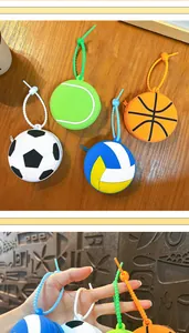 Detail showing colorful sports ball-themed silicone coin purses with beaded straps