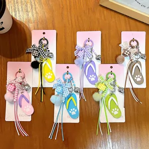 Set of cute flip-flop bag charms in multiple colors with ribbons and pom-poms.