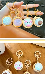 Detail of cute glowing xiao long bao steamed bun keychains for stress relief and bag decor