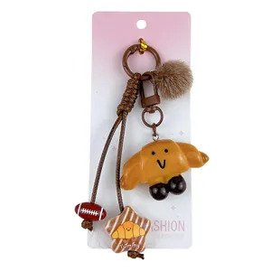Adorable croissant keychain Maillard style brown bread bag charm for student backpacks