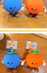 Detailed view of cute fruit mangosteen silicone coin purses with colorful tags and charms