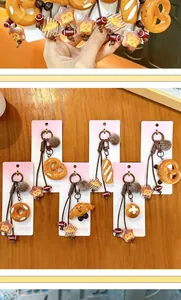 Detailed view of cute Maillard-style bread keychains in various pastry shapes
