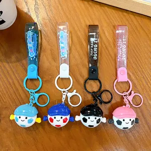 Lot de quatre porte-clés mignons avec poupée de football et dragonnes en PVC coloré