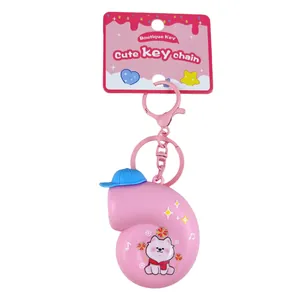 Creative pink music snail keychain with blue hat and cute cartoon dog illustration