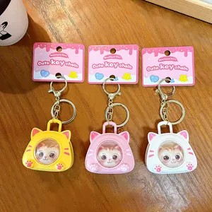 Cute cartoon cat space capsule keychains in yellow, pink, and white plastic design