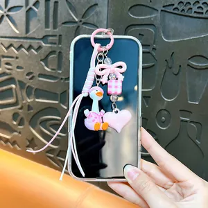 Adorable pink duck keychain featuring a bow heart charm for DIY bag and phone accessory