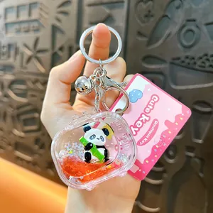Detail view of cute panda game console liquid keychain with bamboo panda figurine