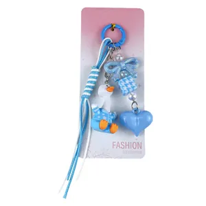 Cute blue duck keychain bag charm with heart and bow for accessories