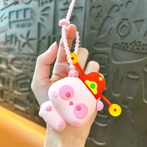 Detail of a cute pink panda squishy toy with traditional Chinese hat as bag charm