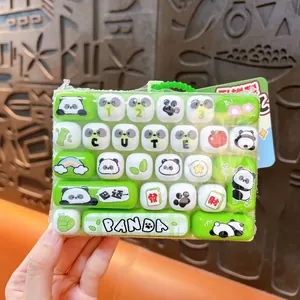 Panda themed 26-key mechanical keyboard fidget toy keychain in green and white finish