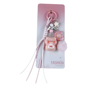 Cute pink pig cartoon keychain bag charm with bow and pom-pom accessory