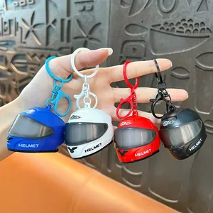 Creative mini helmet keychains with LED light in four vibrant colors for bag decoration