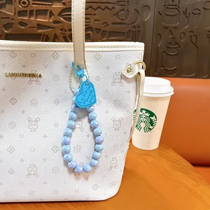 Fashionable blue iridescent AB pearl beaded bag charm with sweet heart tag accessory