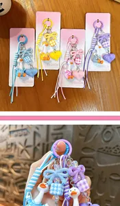 Cute shaking head duck bag charm keychain with heart and ribbon detail ornaments