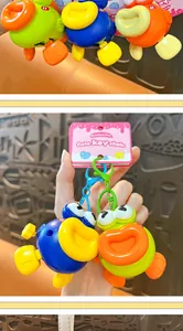 Close-up view of cute clockwork jumping fish keychains in vibrant blue and green colors