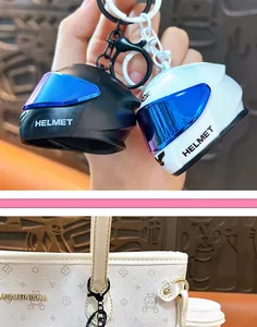 Close-up of cool motorcycle helmet keychains in black and white as bag charms