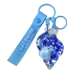 Blue ocean shell liquid oil keychain with floating dolphin and shiny stars glitter charm